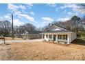 Street view of new cottage homes featuring landscaped yards, welcoming front porches, and private drives at 407 S Spargo St, Dallas, NC 28034