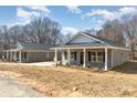 View of two houses showcasing the landscaping and architecture of the homes at 409 S Spargo St, Dallas, NC 28034