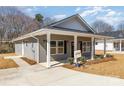 View of house and landscaped yard at 409 S Spargo St, Dallas, NC 28034