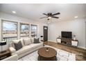 Bright and airy living room with modern furnishings, hardwood floors, and large windows offering natural light at 5310 Myrica Ln, Charlotte, NC 28213