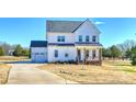 Beautiful two-story home with a garage and a long driveway at 623 Plowshare Way, Clover, SC 29710