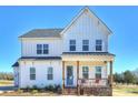 Charming two-story home with white siding, covered porch, and brick accents in a desirable location at 623 Plowshare Way, Clover, SC 29710