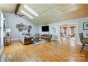 Inviting living room with vaulted ceilings, hardwood floors, natural light, and an open layout at 7201 Cedarfield Rd, Charlotte, NC 28227