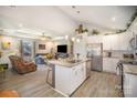Open concept living room and kitchen area with stainless steel appliances, a center island, and modern decor at 1016 E 10Th St, Kannapolis, NC 28083
