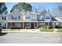 Charming townhomes with lush front lawns, picturesque exteriors, and ample parking at 12742 Spirit Bound Way, Charlotte, NC 28273