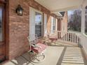 Inviting front porch area with swivel chairs and a small side table for relaxing and enjoying the outdoors at 144 Grandview Dr, Statesville, NC 28677