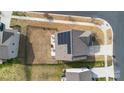 Aerial rooftop view featuring solar panels, fenced yard, and outdoor living at 14815 Superior St, Charlotte, NC 28273