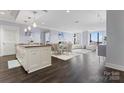 Open-concept living and dining space, featuring modern finishes and hardwood floors at 222 S Caldwell St # 2008, Charlotte, NC 28202