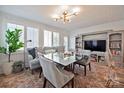 Bright living room featuring stylish furniture, a brick floor and great natural light at 228 Wales Ave, Charlotte, NC 28209