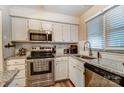 Well-lit kitchen features stainless steel appliances, granite countertops, and ample cabinet space at 2719 Selwyn Ave # 6, Charlotte, NC 28209