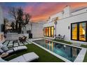 Inviting pool area featuring a modern pool, lounge chairs, and outdoor seating at 2818 Kenwood Sharon Ln, Charlotte, NC 28211