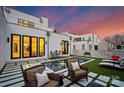 Backyard oasis with a sleek pool, comfortable seating, and manicured artificial turf at 2818 Kenwood Sharon Ln, Charlotte, NC 28211
