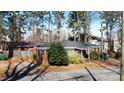 Quaint brick home featuring an inviting entrance and lush greenery at 2921 Fort St, Charlotte, NC 28205