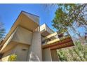 Exterior angle view of a home with a balcony, and large windows at 6366 Sharon Hills Rd, Charlotte, NC 28210