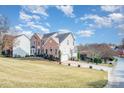 Traditional home with a brick front and siding, featuring a well-maintained lawn and driveway at 768 Knightswood Rd, Fort Mill, SC 29708