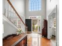 Bright foyer with high ceilings, hardwood floors, staircase, and natural light streaming in at 809 Circle Trace Rd, Monroe, NC 28110