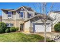 Attractive two-story house boasts a manicured lawn and attached two-car garage at 10436 Cullen Ct, Charlotte, NC 28278