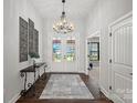 Elegant foyer with high ceilings, double doors and chandelier lighting at 106 Beachview Dr, Mooresville, NC 28117