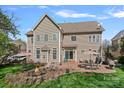 Spacious backyard with a stone fire pit, brick patio, and ample seating, ideal for entertaining at 10823 Caverly Ct, Huntersville, NC 28078