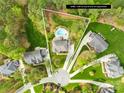 Aerial view of the home showcasing the pool, the 0.68 acre lot, and the surrounding neighborhood at 113 Sandy Cove Ct, Mooresville, NC 28117
