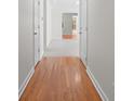 Hallway with hardwood floors and view into room with carpet at 1207 Overhill Rd, Salisbury, NC 28144