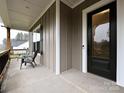Inviting covered porch with comfortable seating, perfect for relaxing and enjoying the outdoors at 1324 Sage Pine Cir, Clover, SC 29710