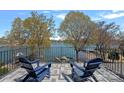 A tranquil balcony view showcases the serene waterfront setting and inviting outdoor space at 17701 Springwinds Dr, Cornelius, NC 28031
