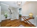 Inviting foyer features beautiful hardwood floors, staircase, and stylish console table adding character to the home at 1774 Hwy 55 E Hwy, Clover, SC 29710
