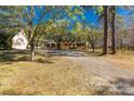 Lovely brick home with mature trees in a spacious front yard with a long driveway at 1774 Hwy 55 E Hwy, Clover, SC 29710