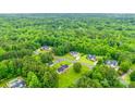 An aerial view of suburban homes and trees at 2050 Sunswept Ln, York, SC 29745
