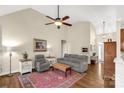 Cozy living room features hardwood floors, a ceiling fan, and neutral tones, creating a comfortable and inviting atmosphere at 2050 Sunswept Ln, York, SC 29745