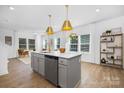 Bright, open kitchen with a large center island, modern appliances, and stylish pendant lighting at 2125 Tom Sadler Rd # 7159, Charlotte, NC 28214
