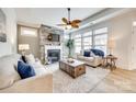 Bright living room with a stone fireplace, large windows, and stylish décor at 333 Lifestyle Ct, Cramerton, NC 28056