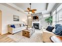 Comfortable living room features a stone fireplace, wooden fan, and stylish furniture at 333 Lifestyle Ct, Cramerton, NC 28056