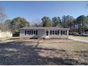 Charming single-story home with black shutters, a well-maintained lawn, and inviting front entrance at 3410 Nc 109 N Hwy, Wadesboro, NC 28170