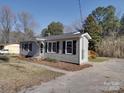 Charming single-story home featuring black shutters and a well-maintained front yard with a concrete driveway at 3410 Nc 109 N Hwy, Wadesboro, NC 28170
