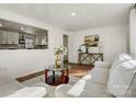 Cozy living room with view into the kitchen, featuring a sofa and stylish decor at 3598 Puett Park Dr, Conover, NC 28613