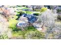 Aerial view of property with a backyard pool, patio, and lush greenery at 4025 4Th Street Nw Ln, Hickory, NC 28601