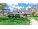 Charming brick home with dormer windows and mature landscaping at 4025 4Th Street Nw Ln, Hickory, NC 28601