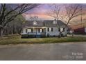 Lovely home with a welcoming front porch, complemented by mature trees and fresh landscaping at 406 E 29Th St, Kannapolis, NC 28083