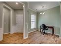 Versatile office space with a large window, hardwood floors, and neutral walls at 4521 Middlebury Ln, Fort Mill, SC 29715