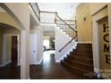 Grand foyer showcasing hardwood floors, staircase with iron railings, and views into the living spaces at 4531 Landmark Dr, Rock Hill, SC 29732