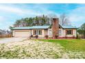 Charming home with tan siding, shutters, a metal roof, and an attached garage at 6142 Gold Creek Estate Dr, Hickory, NC 28601