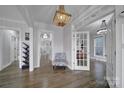 Inviting foyer featuring hardwood floors, elegant lighting, and easy access to the rest of the home at 786 Stratford Run Dr, Fort Mill, SC 29708