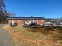 Expansive backyard featuring a deck, ideal for outdoor entertaining and relaxation at 920 Oakridge Farm Hwy, Mooresville, NC 28115