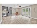 Open kitchen with a dining area featuring stainless steel appliances and a large window at 920 Oakridge Farm Hwy, Mooresville, NC 28115