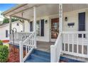 Covered front porch with white railings offering a welcoming entrance at 1006 N Ridge Ave, Kannapolis, NC 28083