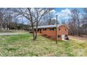Two-story brick home featuring a walkout basement and sprawling backyard at 104 Pop Davis Rd, Taylorsville, NC 28681