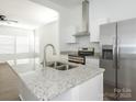 Modern kitchen featuring stainless steel appliances, granite countertops, and bright white cabinets at 1137 Williams St, Rock Hill, SC 29732