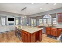 Open concept kitchen featuring a large island with seating and stainless steel appliances at 158 Crimson Orchard Dr, Mooresville, NC 28115
